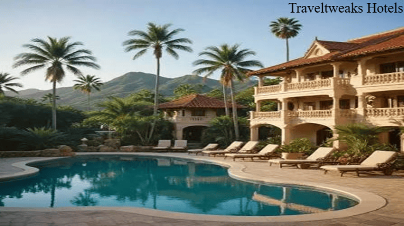 Luxury tropical hotel with a swimming pool, palm trees, sun loungers, and mountain views.